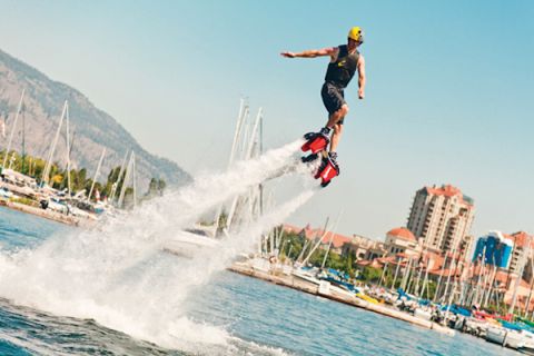 Water activities like flyboards are popular on the Kelowna lakeshore.