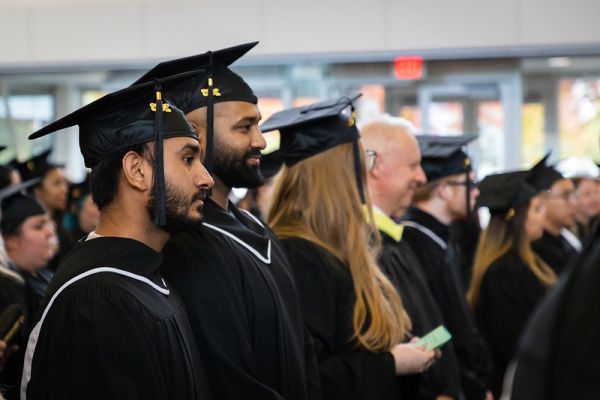 Kelowna students in graduation gowns and caps